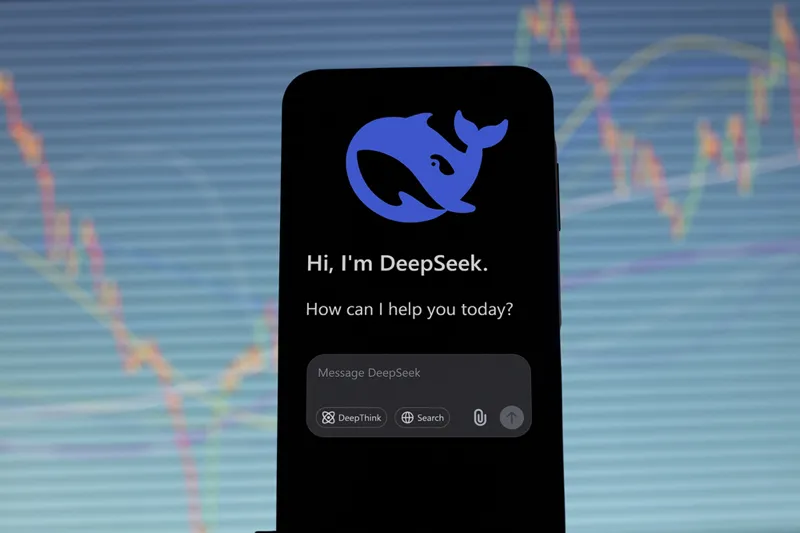 یک صفحه نمایش هوشمند با رابط Deepseek AI Chatbot ، نمایش یک آرم نهنگ و پیام تبریک ، در برابر پس زمینه ای از خطوط نمودار نوسان.